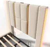 A close-up view of a beige upholstered bed frame with gold accents and integrated LED lighting. Anteprima dell’immagine prodotto