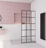 A modern bathroom with pink tiles, marble accents, and a black-framed shower enclosure. Produktbild-Vorschau