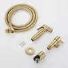 A set of gold-colored bidet spray components laid out on a white background. Produktbild-Vorschau