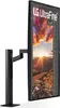A black LG UltraFine monitor is shown in a vertical orientation on a black stand, displaying a landscape image on its screen. Produktbild-Vorschau