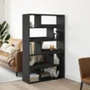 A black bookshelf filled with decorative items, placed in a living room next to a brown leather sofa. Náhled obrázku produktu