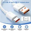 A close-up of a white USB-A to USB-C charging cable with its connectors prominently displayed. Below the cable, there are four icons with German text indicating safety features. Produktbild-Vorschau