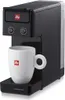 A black Illy iperespresso coffee machine with a white Illy branded mug on its drip tray. Voir les images du produit