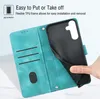 A hand is shown inserting a phone into a teal flip-style phone case. The case is open, revealing card slots and a flexible TPU frame. Produktbild-Vorschau