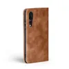 A brown flip cover case for a smartphone is shown against a white background. Produktbild-Vorschau