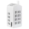 A white ceramic house-shaped tea light holder with cut-out windows and a chimney. Produktbild-Vorschau