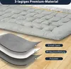 A layered diagram showing the materials of a mattress topper, with the topper itself shown in the background. Podgląd zdjęcia produktu