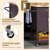 A close-up view of a kitchen cart, highlighting its features like a towel holder and wheels, with text overlays explaining these features. Voir les images du produit