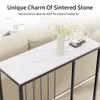 A console table with a marble top and black metal frame, placed in a living room setting next to a sofa. Produktbild-Vorschau