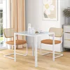 A dining table and chairs set in a bright, modern room. Anteprima dell’immagine prodotto