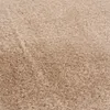 A close-up view of a textured, beige carpet. Náhled obrázku produktu