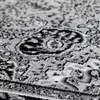 A close-up view of a patterned rug. Produktbild-Vorschau