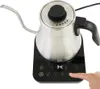 A close-up shot of an electric gooseneck kettle on its base, with a hand pressing a button on the base. Produktbild-Vorschau