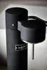 Close-up of a black Aarke carbonator with a silver lever. Produktbild-Vorschau