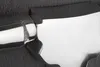 A close-up, abstract view of a metal object with a textured, dark gray surface and a polished silver metallic surface. Produktbild-Vorschau