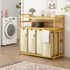 A laundry room with a washing machine and a bamboo laundry sorter with multiple compartments. Anteprima dell’immagine prodotto