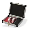 A set of glass drill bits in a silver case. Voir les images du produit