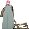 Side view of a light blue backpack with pink handles and a brown strap with text. Voir les images du produit