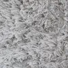 A close-up, textured view of a gray shaggy rug. Anteprima dell’immagine prodotto