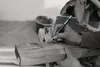 A person is using a marking pencil to draw on a piece of wood. Produktbild-Vorschau