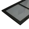 A close-up, angled view of a black-framed glass door, showing the frame and a portion of the glass. Produktbild-Vorschau