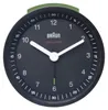 A close-up studio shot of a black Braun alarm clock with white hands and markings. Produktbild-Vorschau