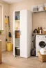 A laundry room with a utility cabinet, washing machine, and cleaning supplies. Anteprima dell’immagine prodotto
