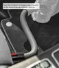 A flexible hose from a vacuum cleaner is shown being used to clean the interior of a car, specifically the floor mat and seat area. Produktbild-Vorschau