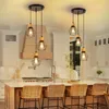 A modern kitchen island with pendant lights hanging above it. Voir les images du produit