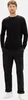 A man wearing a black sweater and black pants, standing against a white background. Produktbild-Vorschau