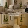 Collage of four images showing a small LED Christmas tree in different settings, with text overlay. Produktbild-Vorschau