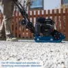 A person is using a plate compactor on a gravel surface in an outdoor setting. Podgląd zdjęcia produktu