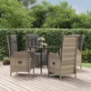 A patio dining set with four chairs and a table is set up on a wooden deck, surrounded by lush green hedges and trees. Voir les images du produit