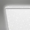 A close-up, angled view of a modern LED ceiling light with a star-like pattern. Produktbild-Vorschau