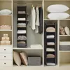 An organized closet with hanging shelves and folded items. Produktbild-Vorschau