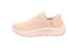 A side view of a beige Skechers sneaker against a white background. Voir les images du produit