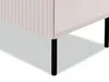 A close-up view of the bottom corner of a white cabinet with fluted detailing on the side and black metal legs. Náhled obrázku produktu