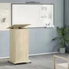 A podium with a whiteboard and a plant in the background. Náhled obrázku produktu