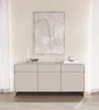 A minimalist sideboard with three doors and three drawers, presented in a neutral, well-lit room. Náhľad obrázku produktu
