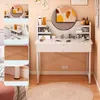 A white vanity desk with a round mirror and various beauty products is shown. Podgląd zdjęcia produktu