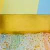 A close-up view of a colorful, layered fabric, likely part of a costume or garment, with a golden ribbon band. Anteprima dell’immagine prodotto
