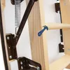 A close-up view of the mechanical components and wooden structure of a folding attic ladder. Podgląd zdjęcia produktu