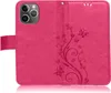 A pink flip case for an Apple iPhone 13 Pro, with a floral and butterfly embossed design. Produktbild-Vorschau