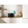 A Gorenje microwave is placed on a kitchen counter next to a refrigerator. Anteprima dell’immagine prodotto