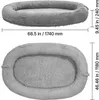 Two views of a gray, oval-shaped dog bed with dimensions indicated. Voir les images du produit