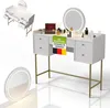A white and gold vanity table with a round LED mirror and various makeup items on top. A smaller mirror is shown in the foreground. A separate view of the vanity table is shown in the upper left corner. Náhľad obrázku produktu