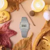 A Casio watch is placed among autumn leaves, cookies, and candles, creating a cozy, seasonal atmosphere. Produktbild-Vorschau