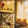Collage of three lifestyle shots showing string lights used for decoration in different settings: on a table with flowers, draped over a window with curtains, and wrapped around a staircase with garland. Voir les images du produit