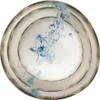 A stack of three plates with a blue abstract design on the inner plate and a textured gray rim on all plates. Produktbild-Vorschau