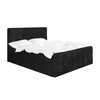 A black boxspring bed with white bedding, shown from a side angle against a white background. Produktbild-Vorschau
